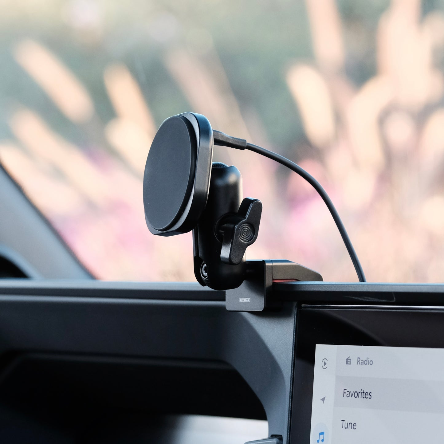Image of Offroam MagSafe-compatible Phone Mount installed securely in Toyota Land Cruiser Prado 250 2024-2025. This premium phone mount installs easily without drilling or glue. High force magnets hold phone on any trail, road, or track. Perfect placement without blocking screens, driver view, or air flow. Fully adjustable positioning.