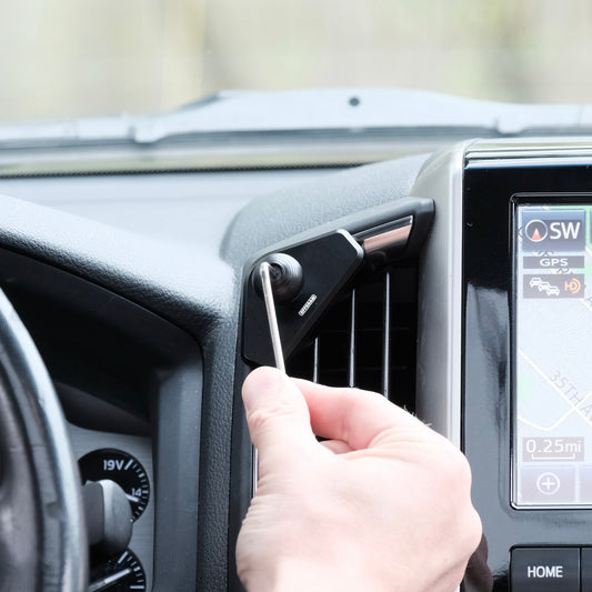 Image of Offroam Mounting Base installed securely in Toyota Land Cruiser 200 2016-2021. This premium all metal phone mounting base installs easily without drilling or glue. Perfect placement without blocking screens, driver view, or air flow.