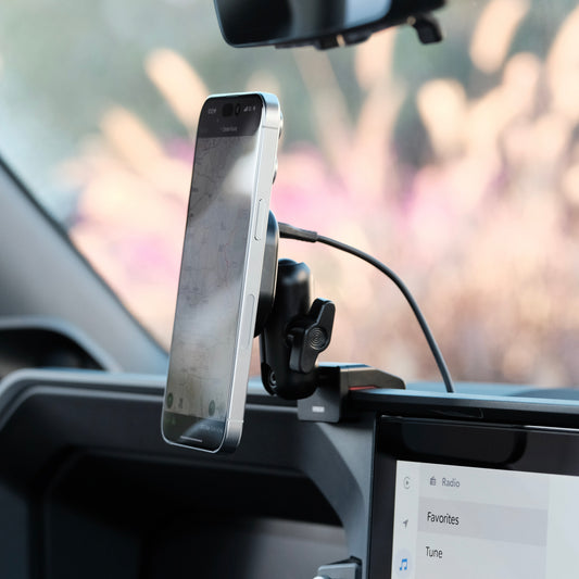 Image of Offroam MagSafe-compatible Phone Mount installed securely in Toyota Land Cruiser Prado 250 2024-2025. This premium phone mount installs easily without drilling or glue. High force magnets hold phone on any trail, road, or track. Perfect placement without blocking screens, driver view, or air flow. Fully adjustable positioning.