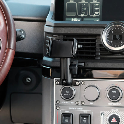 Image of Offroam Phone Mount installed securely in INEOS Grenadier 2022-2025. This premium phone mount installs easily without drilling or glue. Spring loaded Universal holder for use with any phone. Perfect placement without blocking screens, driver view, or air flow. Fully adjustable positioning.