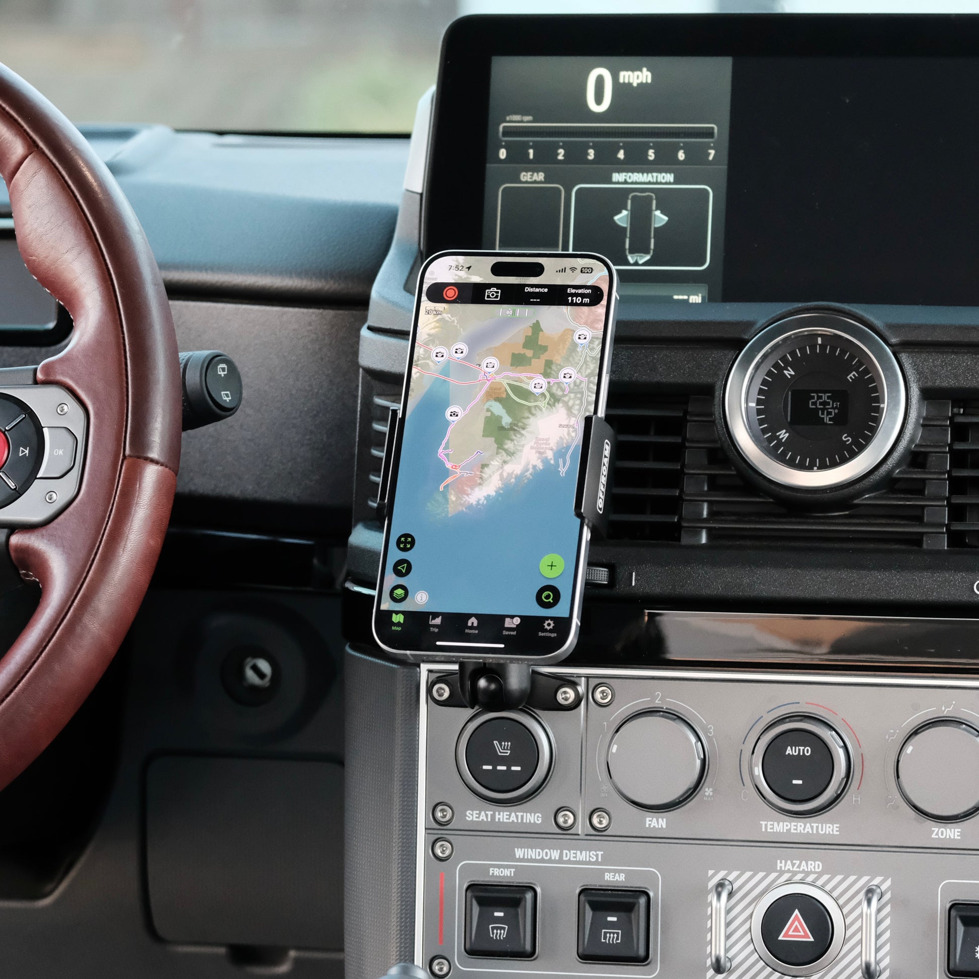 Image of Offroam Phone Mount installed securely in INEOS Grenadier 2022-2025. This premium phone mount installs easily without drilling or glue. Spring loaded Universal holder for use with any phone. Perfect placement without blocking screens, driver view, or air flow. Fully adjustable positioning.