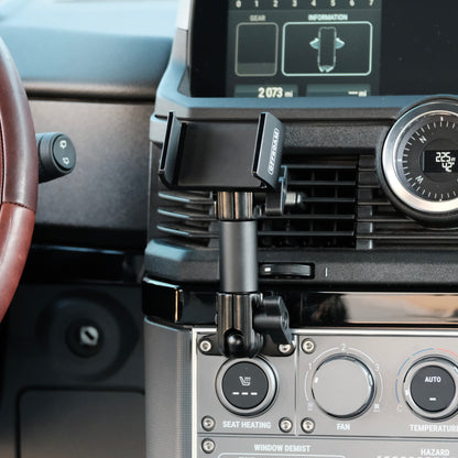 Image of Offroam Phone Mount installed securely in INEOS Grenadier 2022-2025. This premium phone mount installs easily without drilling or glue. Spring loaded Universal holder for use with any phone. Perfect placement without blocking screens, driver view, or air flow. Fully adjustable positioning.