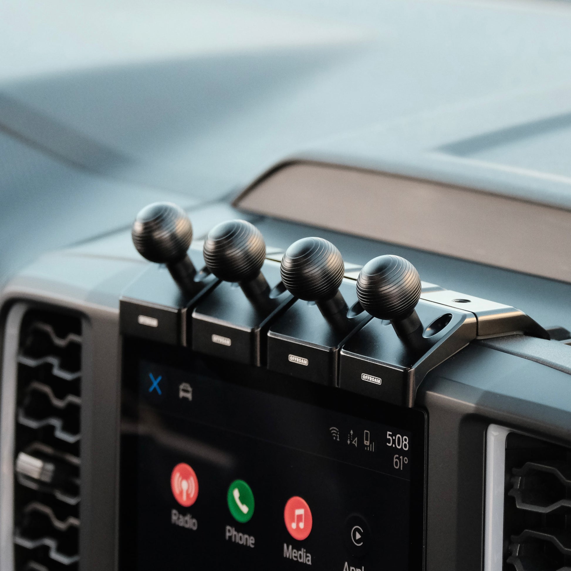 Image of 4 Offroam Mounting Bases installed securely in Ford Ranger | Everest 2022-2025. This premium all metal phone mounting base installs easily without drilling or glue. Perfect placement without blocking screens, driver view, or air flow.