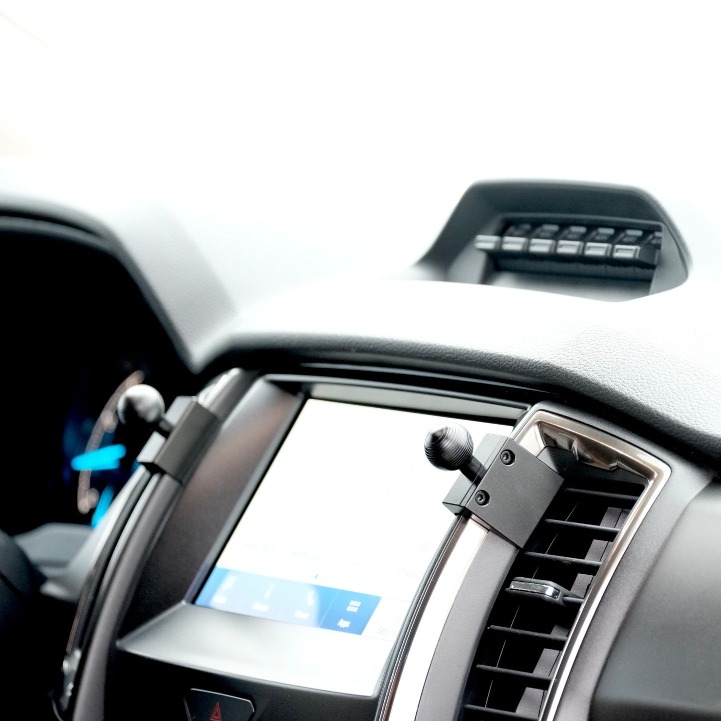 Image of Offroam Mounting Bases installed securely in Ford Ranger | Everest 2015-2021. This premium all metal phone mounting base installs easily without drilling or glue. Perfect placement without blocking screens, driver view, or air flow.