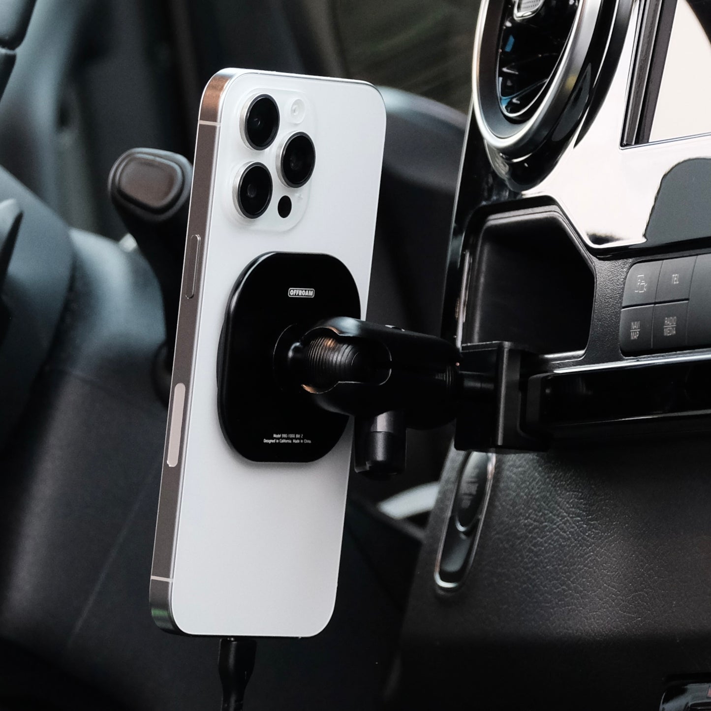 Image of Offroam MagSafe-compatible Phone Mount installed securely in Mercedes-Benz Sprinter 2019-2026. This premium phone mount installs easily without drilling or glue. High force magnets hold phone on any trail, road, or track. Perfect placement without blocking screens, driver view, or air flow. Fully adjustable positioning.