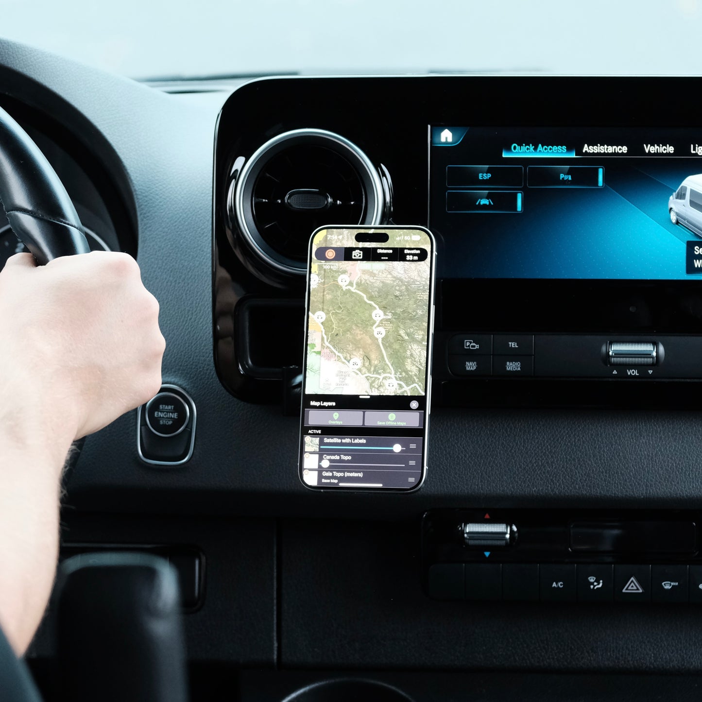 Image of Offroam MagSafe-compatible Phone Mount installed securely in Mercedes-Benz Sprinter 2019-2026. This premium phone mount installs easily without drilling or glue. High force magnets hold phone on any trail, road, or track. Perfect placement without blocking screens, driver view, or air flow. Fully adjustable positioning.