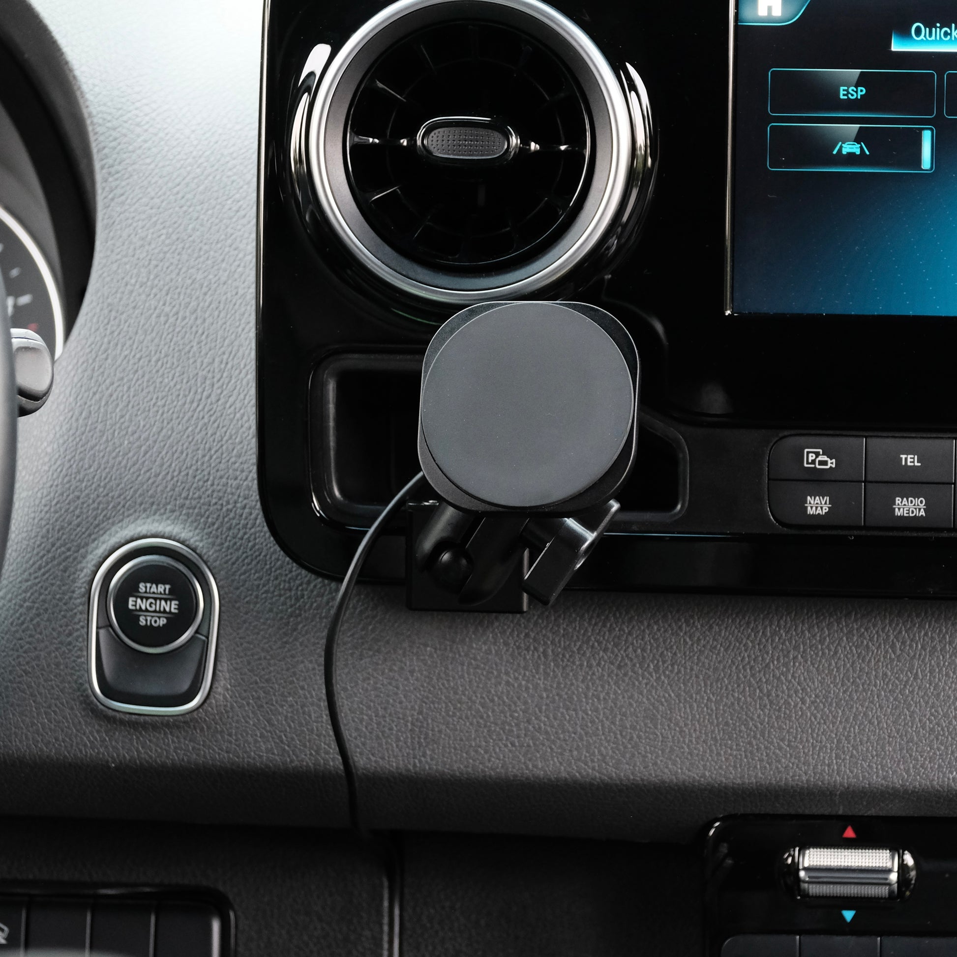 Image of Offroam MagSafe-compatible Phone Mount installed securely in Mercedes-Benz Sprinter 2019-2026. This premium phone mount installs easily without drilling or glue. High force magnets hold phone on any trail, road, or track. Perfect placement without blocking screens, driver view, or air flow. Fully adjustable positioning.