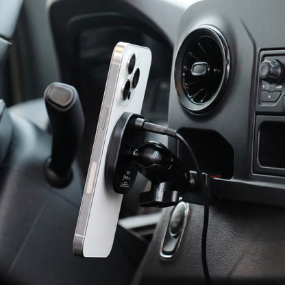 Image of Offroam MagSafe-compatible Phone Mount installed securely in Mercedes-Benz Sprinter 2019-2026. This premium phone mount installs easily without drilling or glue. High force magnets hold phone on any trail, road, or track. Perfect placement without blocking screens, driver view, or air flow. Fully adjustable positioning.