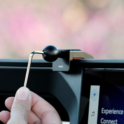 Image of Offroam Mounting Base installed securely in Toyota Land Cruiser Prado 250 2024-2025. This premium all metal phone mounting base installs easily without drilling or glue. Perfect placement without blocking screens, driver view, or air flow.