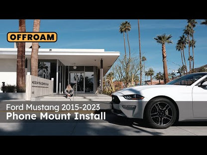 Image of Offroam Phone Mount installation for Ford Mustang 2015-2023. This premium phone mount installs easily without drilling or glue. Spring loaded Universal holder for use with any phone. Perfect placement without blocking screens, driver view, or air flow. Fully adjustable positioning.