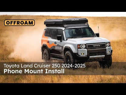 Video of Offroam Phone Mount installation for Toyota Land Cruiser Prado 250 2024-2025. This premium phone mount installs easily without drilling or glue. Spring loaded Universal holder for use with any phone. Perfect placement without blocking screens, driver view, or air flow. Fully adjustable positioning.